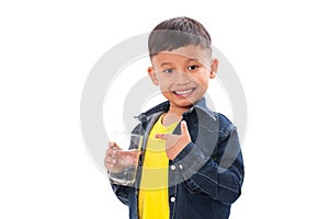 Happy boy holding glass of water.