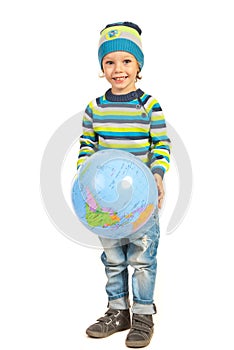 Happy boy holding inflate globe