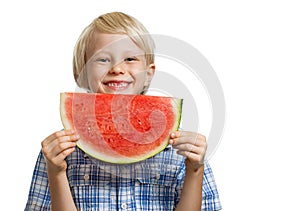 Happy boy holding slice of watermelon