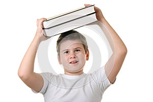 Happy boy holds some books over head