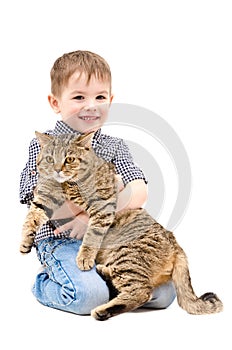 Happy boy hugging a cat Scottish Straight