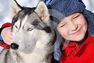 Happy boy with husky dog