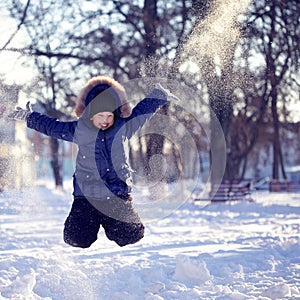 Happy boy jump outdoors