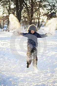 Happy boy jump outdoors