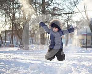 Happy boy jump outdoors