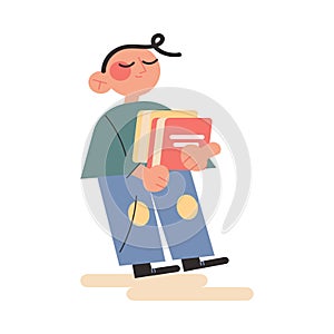 Happy boy kid standing and holding heap of books for reading