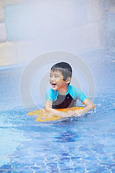 Happy boy learn to swim