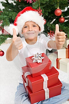 Happy boy with lots of christmas presents