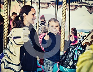 Happy Boy and Mother on Carousel - Retro