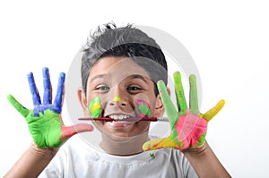 Happy boy with paint having fun