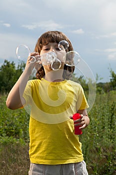 Happy boy play in bubbles