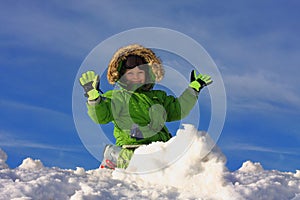 Happy Boy Playing In Snow