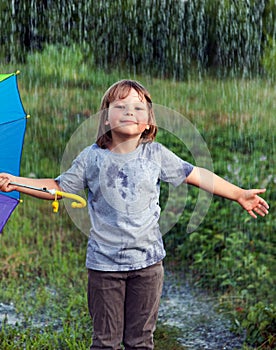 Happy boy in rain