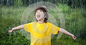 Happy boy in rain