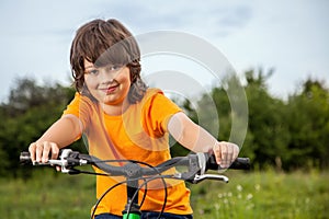 Happy boy ride bikes outdoors