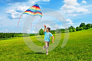 Happy boy run with kite photo