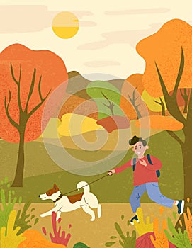 Happy boy running with a dog in autumn park