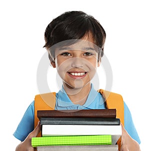 Happy boy in school uniform with  of books on white background