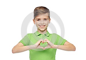 Happy boy showing heart hand sign