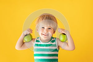 Happy boy showing muscles