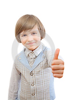 Happy boy is showing thumb up gesture