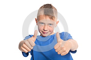 Happy boy showing thumbs up gesture