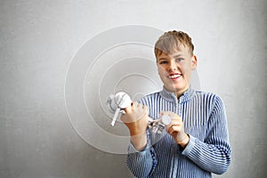 Happy boy shows faucet water in repairable