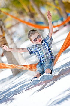 Happy boy sitting in hammock