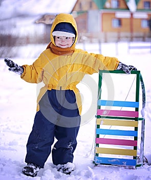Happy boy with sled