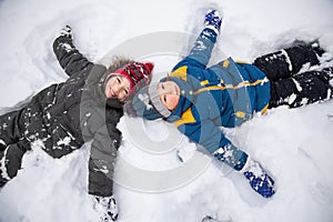 Happy boy in snow play and smile sunny day outdoors