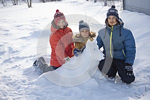 Happy boy in snow play and smile sunny day outdoors