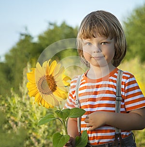 Happy boy with sunflower