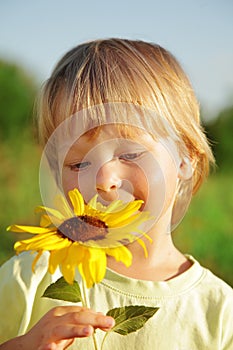 Happy boy with sunflower