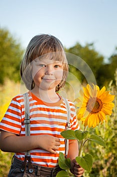 Happy boy with sunflower