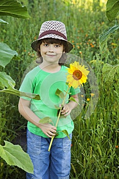 Happy boy with sunflower