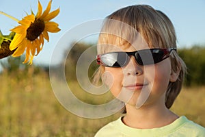 Happy boy with sunflower