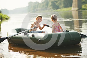 Happy boy swimming in fishing boat