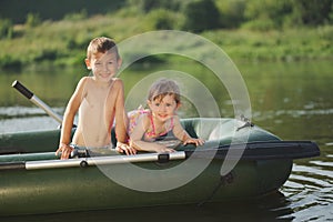 Happy boy swimming in fishing boat