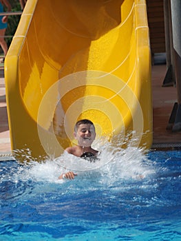 Happy boy swimming in the pool