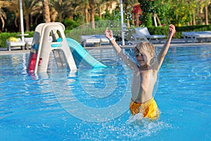 Happy boy in swimming pool