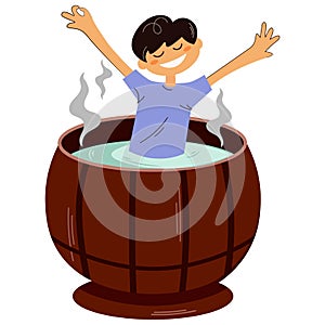 Happy boy taking spa treatments in a hot tub or wooden barrel. The concept of entertainment in a sauna or spa, wellness