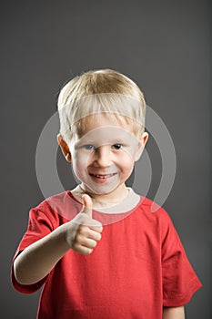 Happy boy with thumb up