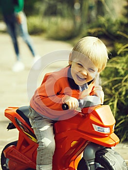 Happy boy on toy bike