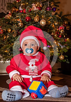 Happy boy under Christmas tree