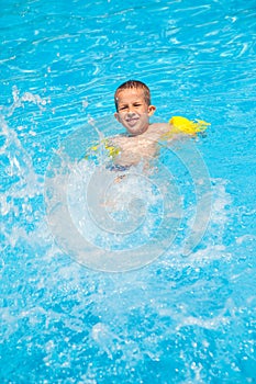 Happy boy with water rings have a fun