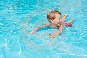 Happy boy in waterpool