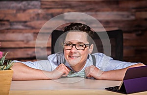 Happy Boyish Boss at Desk