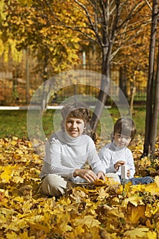 Happy boys in autumn park