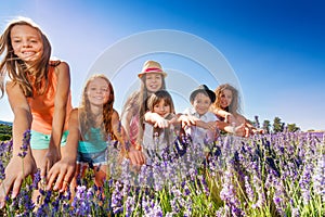Happy boys and girls having fun in lavender field