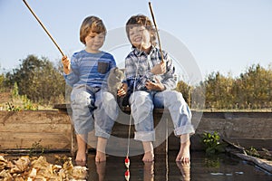Happy boys go fishing on the river, Two children of the fisher w